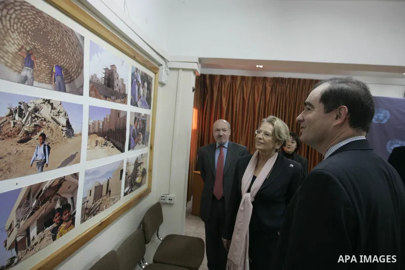 French Foreign Minister Michele Alliot Marie looks at pictures at the U.N. office in Gaza City, on Jan. 21, 2011. A crowd of furious Palestinian protesters tried to block the French foreign minister on her way into the G...