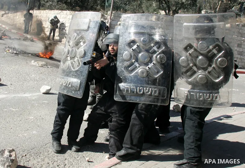 Israeli soldiers take position during clashes with Palestinian youths in the Arab east Jerusalem neighbourhood of Silwan on January 21, 2011. Photo by Mahfouz Abu Turk