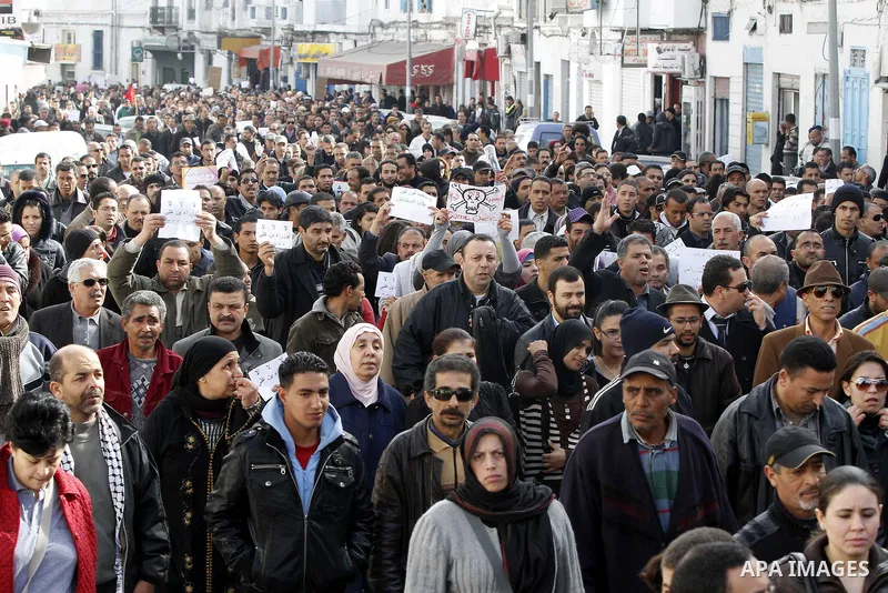 Protestors shout slogans in front of the Prime Minister's office in Tunis, Friday, Jan. 21 2011. Several hundred demonstrators also gathered peacefully across from the long-dreaded Interior Ministry in central Tunis, cha...