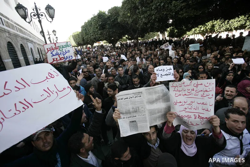 Protestors shout slogans in front of the Prime Minister's office in Tunis, Friday, Jan. 21 2011. Several hundred demonstrators also gathered peacefully across from the long-dreaded Interior Ministry in central Tunis, cha...