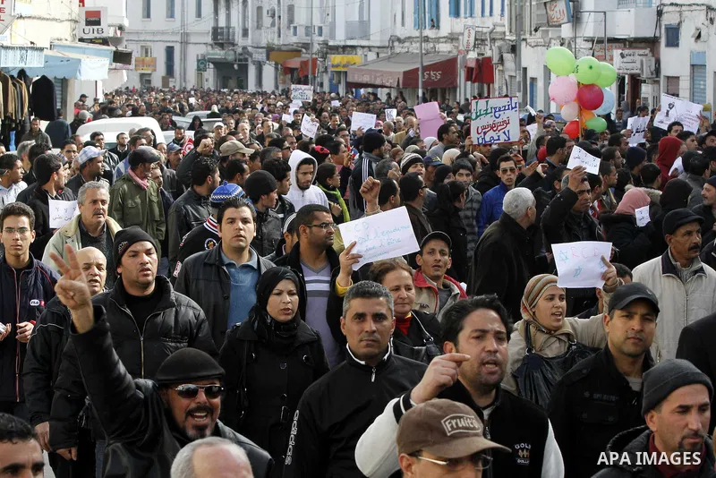 Protestors shout slogans in front of the Prime Minister's office in Tunis, Friday, Jan. 21 2011. Several hundred demonstrators also gathered peacefully across from the long-dreaded Interior Ministry in central Tunis, cha...