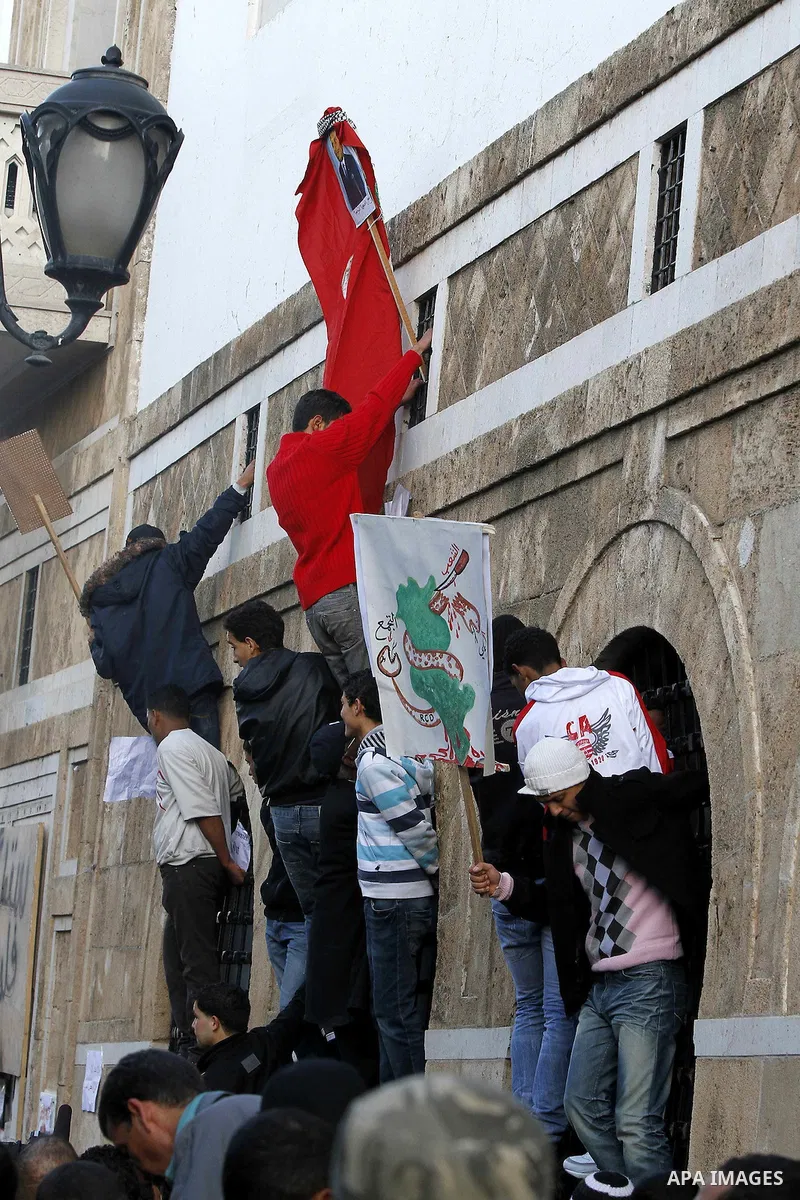 Protestors shout slogans in front of the Prime Minister's office in Tunis, Friday, Jan. 21 2011. Several hundred demonstrators also gathered peacefully across from the long-dreaded Interior Ministry in central Tunis, cha...