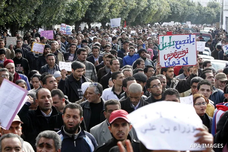 Protestors shout slogans in front of the Prime Minister's office in Tunis, Friday, Jan. 21 2011. Several hundred demonstrators also gathered peacefully across from the long-dreaded Interior Ministry in central Tunis, cha...