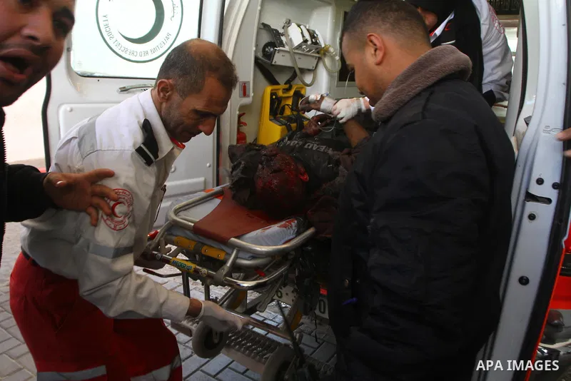 A wounded Palestinian is wheeled into Gaza City's Al-Shifa hospital following Israeli artillery fire on the eastern sector near the border with Israel on January 22, 2011 in which one Palestinian man was killed and two w...