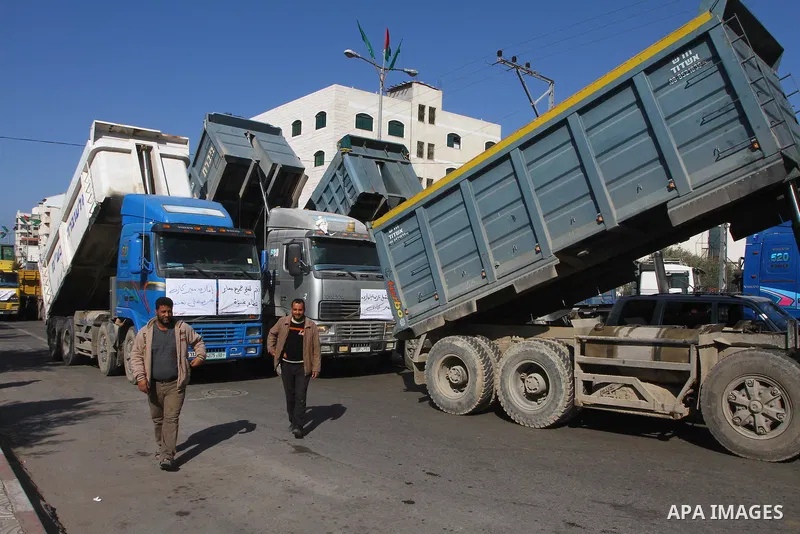 Palestinian truck drivers take a part in a rally to demand cancel of the Israeli decision to close the Karni crossing permanently, in Gaza City on Jan. 22, 2011. Photo by Ashraf Amra