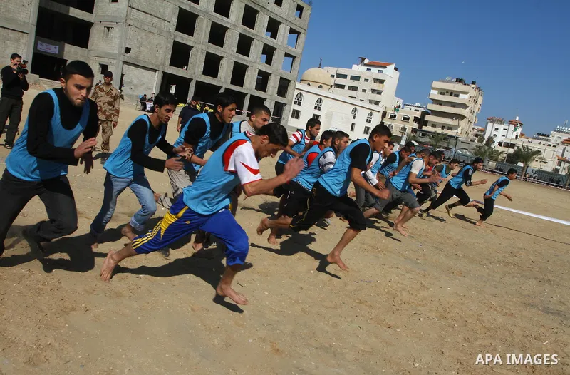 Palestinian candidates perform a physical test at a Hamas police recruitment center in Gaza City on January 22, 2011. Photo by Ashraf Amra