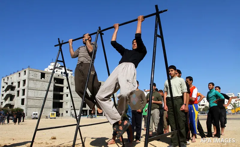 Palestinian candidates perform a physical test at a Hamas police recruitment center in Gaza City on January 22, 2011. Photo by Ashraf Amra