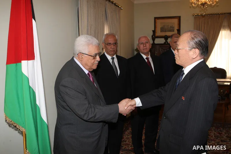 Palestinian President Mahmoud Abbas, accepts the credentials of North Korea's ambassador, in Cairo on Jan. 24, 2011. Photo by Thaer Ganaim