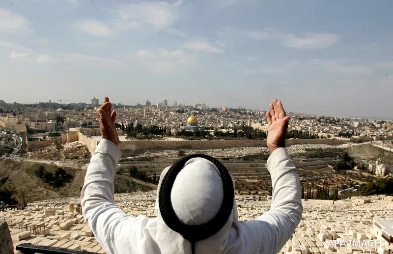 A Palestinian man stands on a bridge overlooking east Jerusalem, Monday, Jan. 24, 2011. Palestinians were prepared to compromise over two of the toughest issues, Jerusalem and refugees, during peace talks in 2008, accord...