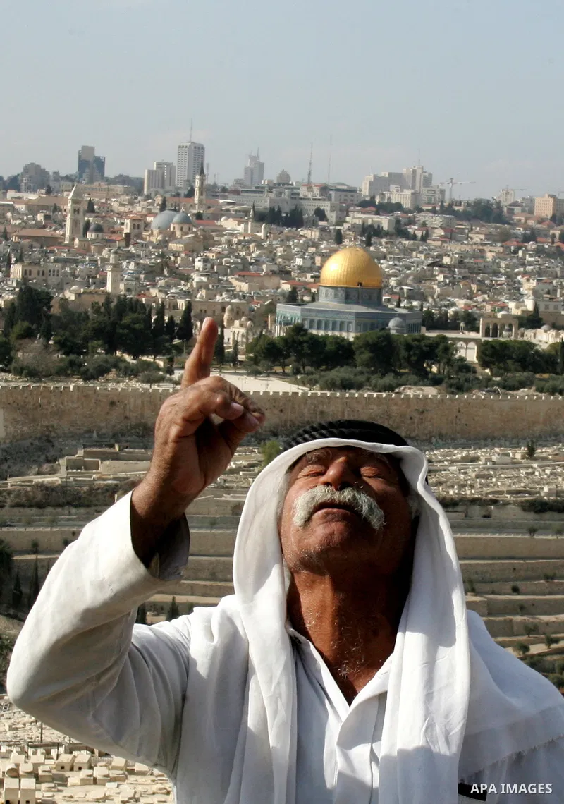 A Palestinian man stands on a bridge overlooking east Jerusalem, Monday, Jan. 24, 2011. Palestinians were prepared to compromise over two of the toughest issues, Jerusalem and refugees, during peace talks in 2008, accord...