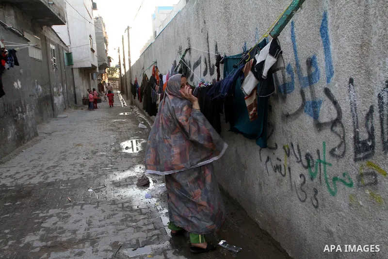 Palestinian refugee children play in front of their home in the Jabalia refugee camp in the northern Gaza Strip on January 24, 2011 a day after leaked documents were published by Al-Jazeera and the British newspaper the...