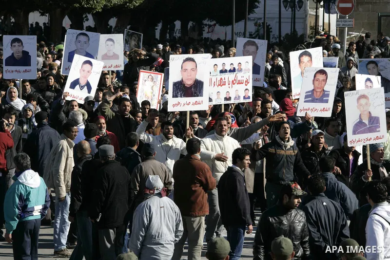 Tunisian protesters gather to demand a new government free of officials of the ousted regime of former president Zine el Abidine Ben Ali, near the Prime Minister's office in Tunis, Tunisia, 24 January 2011. According to...
