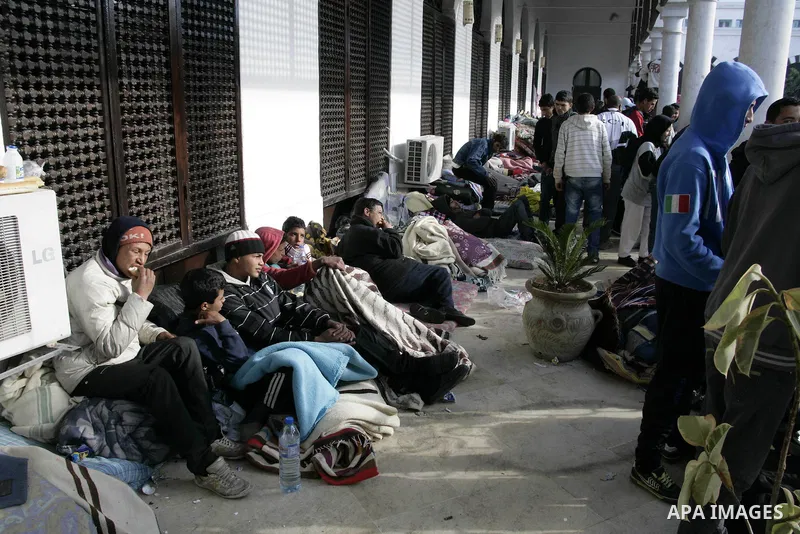 Tunisian protesters gather to demand a new government free of officials of the ousted regime of former president Zine el Abidine Ben Ali, near the Prime Minister's office in Tunis, Tunisia, 24 January 2011. According to...