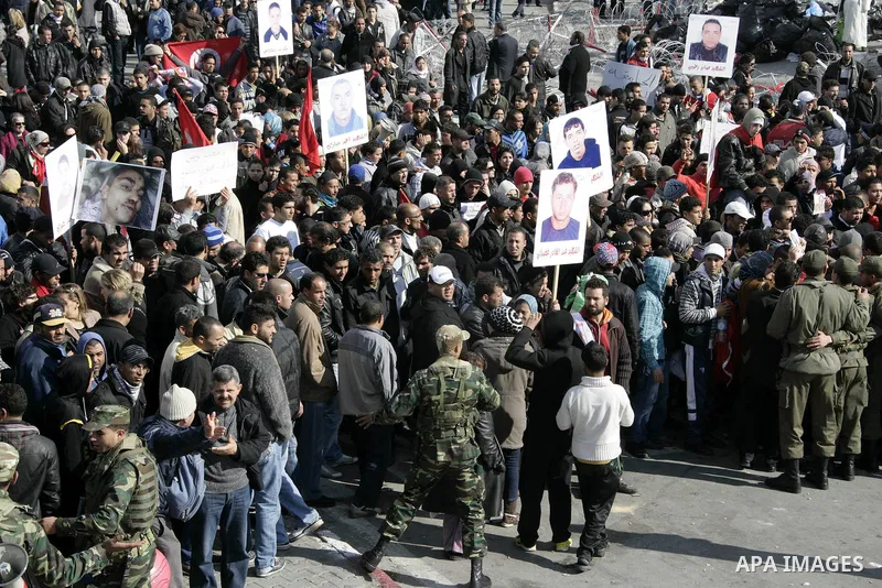 Tunisian protesters gather to demand a new government free of officials of the ousted regime of former president Zine el Abidine Ben Ali, near the Prime Minister's office in Tunis, Tunisia, 24 January 2011. According to...