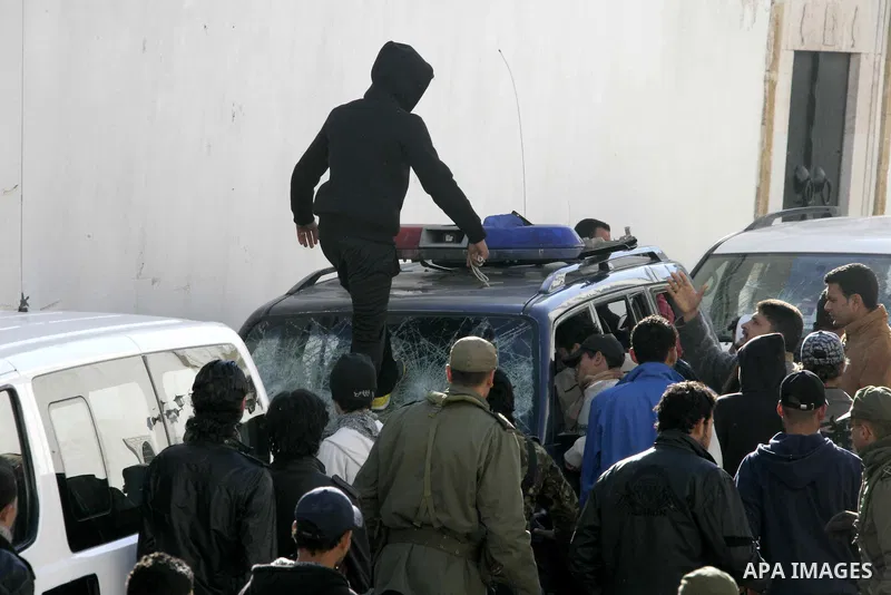 Tunisian protesters gather to demand a new government free of officials of the ousted regime of former president Zine el Abidine Ben Ali, near the Prime Minister's office in Tunis, Tunisia, 24 January 2011. According to...