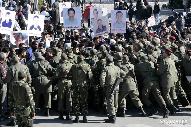Tunisian protesters gather to demand a new government free of officials of the ousted regime of former president Zine el Abidine Ben Ali, near the Prime Minister's office in Tunis, Tunisia, 24 January 2011. According to...