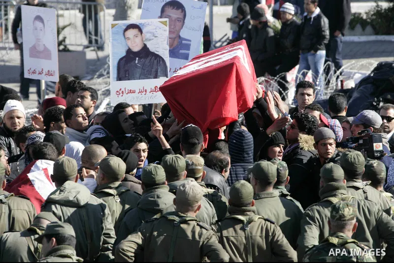 Tunisian protesters gather to demand a new government free of officials of the ousted regime of former president Zine el Abidine Ben Ali, near the Prime Minister's office in Tunis, Tunisia, 24 January 2011. According to...