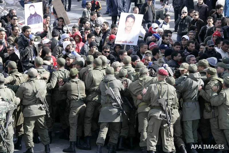 Tunisian protesters gather to demand a new government free of officials of the ousted regime of former president Zine el Abidine Ben Ali, near the Prime Minister's office in Tunis, Tunisia, 24 January 2011. According to...