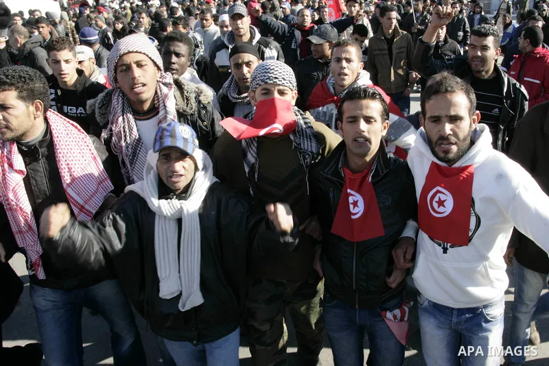 Tunisian protesters gather to demand a new government free of officials of the ousted regime of former president Zine el Abidine Ben Ali, near the Prime Minister's office in Tunis, Tunisia, 24 January 2011. According to...