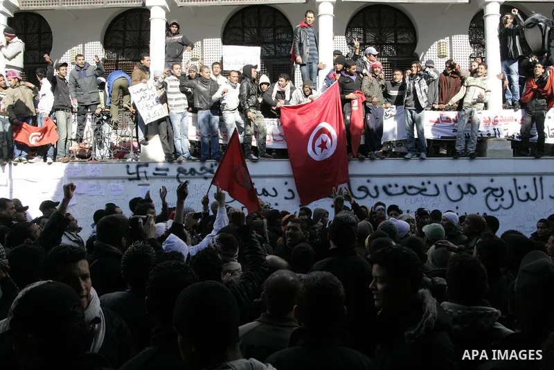 Tunisian protesters gather to demand a new government free of officials of the ousted regime of former president Zine el Abidine Ben Ali, near the Prime Minister's office in Tunis, Tunisia, 24 January 2011. According to...