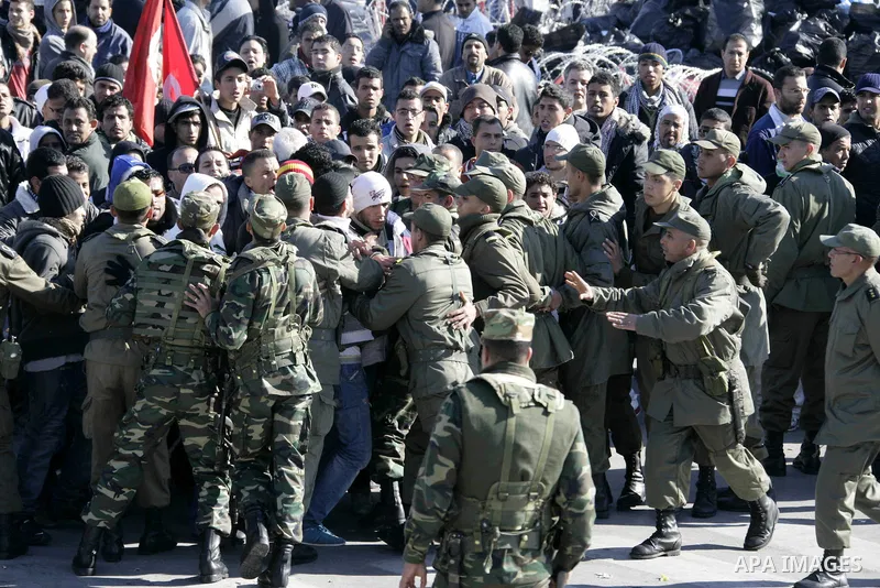 Tunisian protesters gather to demand a new government free of officials of the ousted regime of former president Zine el Abidine Ben Ali, near the Prime Minister's office in Tunis, Tunisia, 24 January 2011. According to...