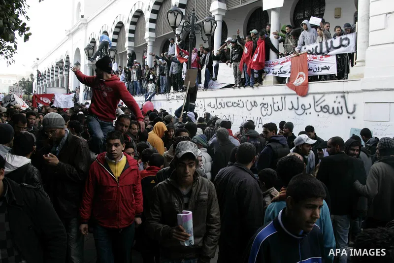 Tunisian protesters gather to demand a new government free of officials of the ousted regime of former president Zine el Abidine Ben Ali, near the Prime Minister's office in Tunis, Tunisia, 24 January 2011. According to...
