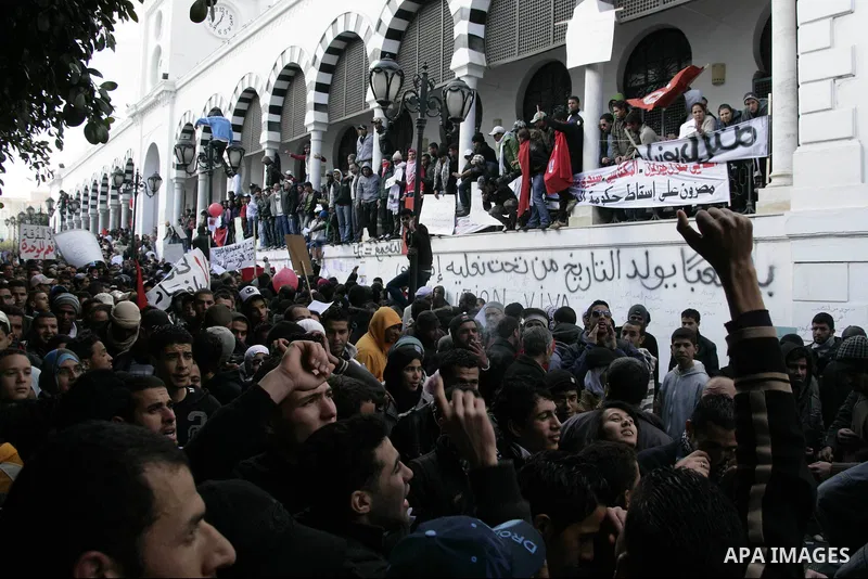 Tunisian protesters gather to demand a new government free of officials of the ousted regime of former president Zine el Abidine Ben Ali, near the Prime Minister's office in Tunis, Tunisia, 24 January 2011. According to...