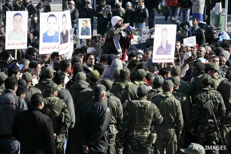 Tunisian protesters gather to demand a new government free of officials of the ousted regime of former president Zine el Abidine Ben Ali, near the Prime Minister's office in Tunis, Tunisia, 24 January 2011. According to...