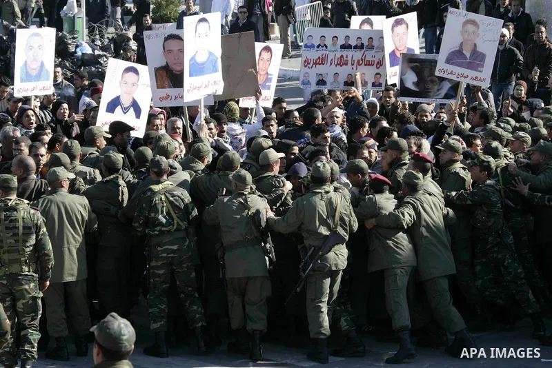Tunisian protesters gather to demand a new government free of officials of the ousted regime of former president Zine el Abidine Ben Ali, near the Prime Minister's office in Tunis, Tunisia, 24 January 2011. According to...