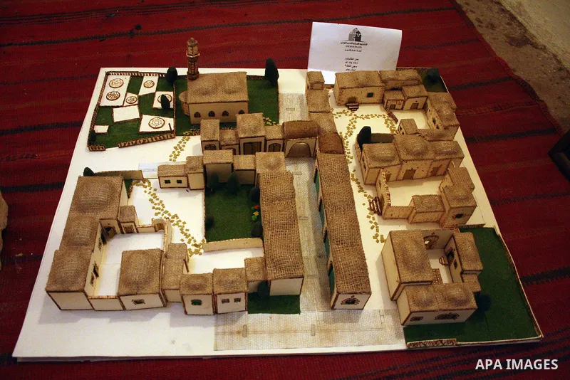 Visitors look at callgraphic works during the opening of the ( Old City Museum ) in the old city of the West Bank city of Hebron on January 25, 2011. The museum located in " Haret Dari " near the Khan al-Khalil, it was o...