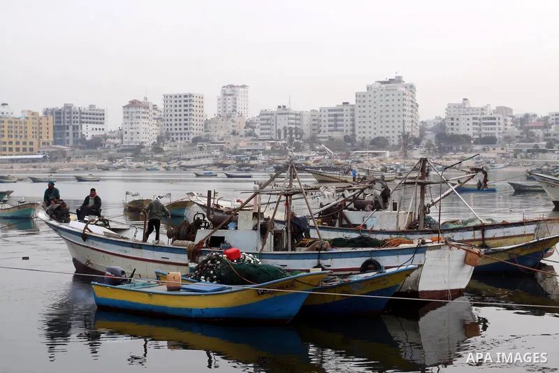 Palestinian fishermen work inside the port of Gaza City on Jan. 25, 2011. Fishermen, suffer from the tightening of the Israeli siege imposed on Palestinian fishermen a forbidden fishermen by Israel to enter the sea for m...