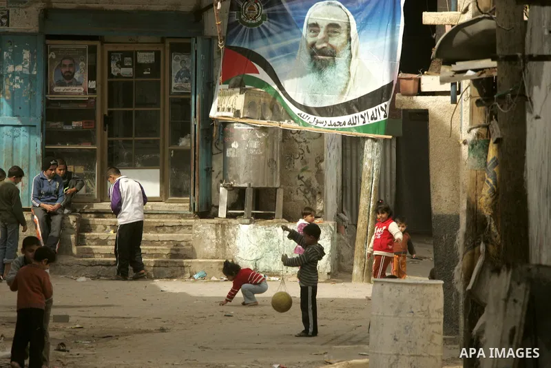Palestinian children play in alley in the Rafah refugee camp in the southern Gaza Strip on January 25, 2011, a day after it was leaked by Al-Jazeera in revealed documents that Palestinian negotiators accepted Israel's pr...