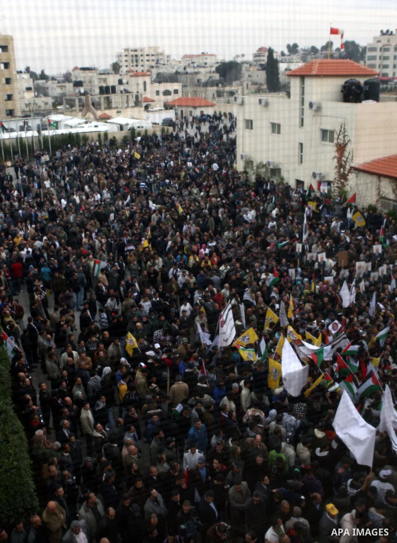 Palestinian President Mahmoud Abbas is welcomed by his supporters upon his arrival from Cairo at the West Bank city of Ramallah January 25, 2011. Abbas got a hero's welcome on Tuesday from thousands of Palestinians who d...