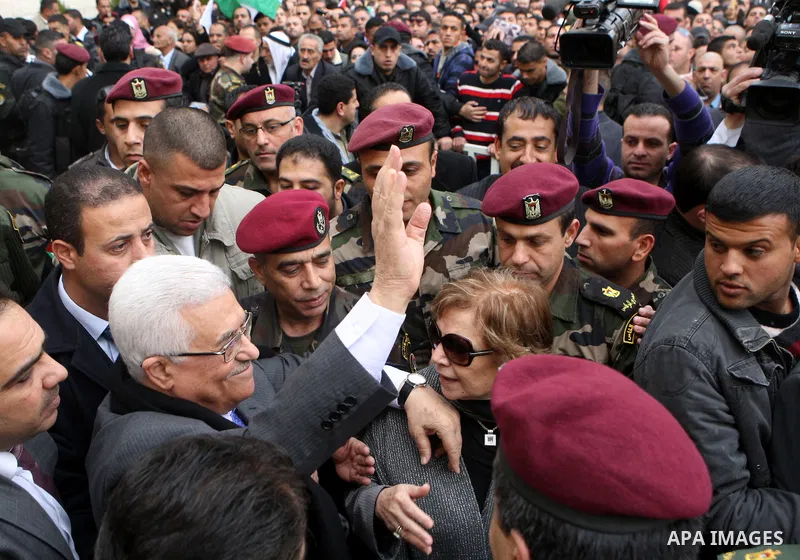 Palestinian President Mahmoud Abbas is welcomed by his supporters upon his arrival from Cairo at the West Bank city of Ramallah January 25, 2011. Abbas got a hero's welcome on Tuesday from thousands of Palestinians who d...
