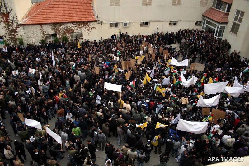 Palestinian President Mahmoud Abbas is welcomed by his supporters upon his arrival from Cairo at the West Bank city of Ramallah January 25, 2011. Abbas got a hero's welcome on Tuesday from thousands of Palestinians who d...