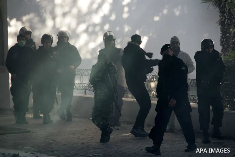 Tunisian policemen fire tear gas canisters at protestors during a demonstration against Prime Minister Mohammed Ghannouchi in front of the government palace in Tunis.Tunisia, 26 January 2011, Hundreds of defiant Tunisian...