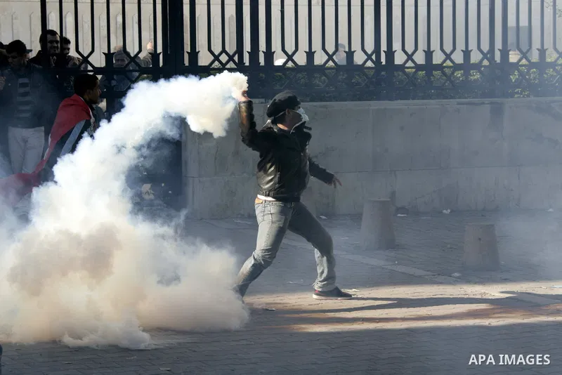 Tunisian policemen fire tear gas canisters at protestors during a demonstration against Prime Minister Mohammed Ghannouchi in front of the government palace in Tunis.Tunisia, 26 January 2011, Hundreds of defiant Tunisian...