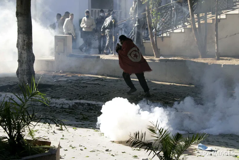 Tunisian policemen fire tear gas canisters at protestors during a demonstration against Prime Minister Mohammed Ghannouchi in front of the government palace in Tunis.Tunisia, 26 January 2011, Hundreds of defiant Tunisian...