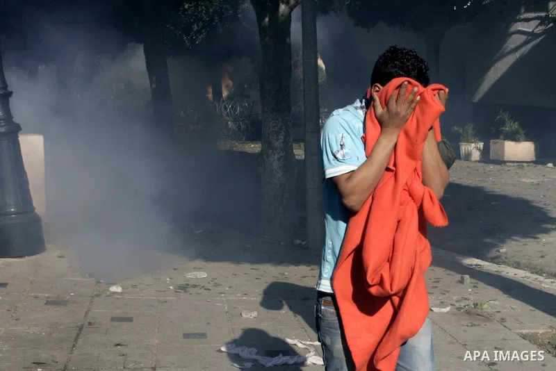 Tunisian policemen fire tear gas canisters at protestors during a demonstration against Prime Minister Mohammed Ghannouchi in front of the government palace in Tunis.Tunisia, 26 January 2011, Hundreds of defiant Tunisian...