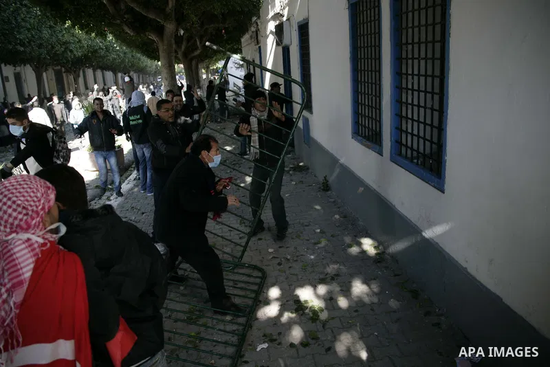 Tunisian policemen fire tear gas canisters at protestors during a demonstration against Prime Minister Mohammed Ghannouchi in front of the government palace in Tunis.Tunisia, 26 January 2011, Hundreds of defiant Tunisian...