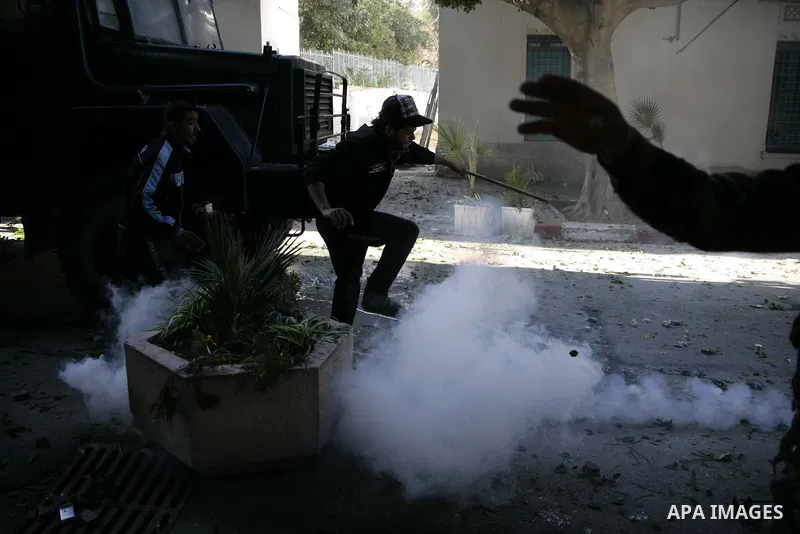 Tunisian policemen fire tear gas canisters at protestors during a demonstration against Prime Minister Mohammed Ghannouchi in front of the government palace in Tunis.Tunisia, 26 January 2011, Hundreds of defiant Tunisian...