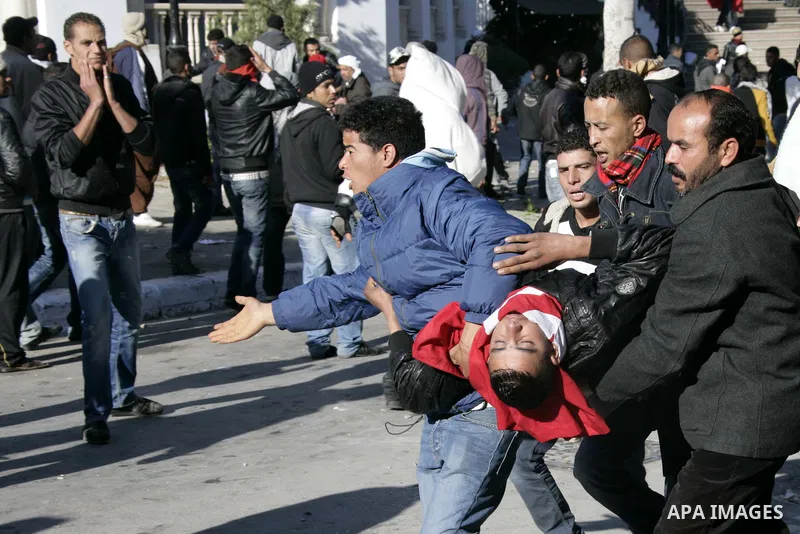 Tunisian policemen fire tear gas canisters at protestors during a demonstration against Prime Minister Mohammed Ghannouchi in front of the government palace in Tunis.Tunisia, 26 January 2011, Hundreds of defiant Tunisian...