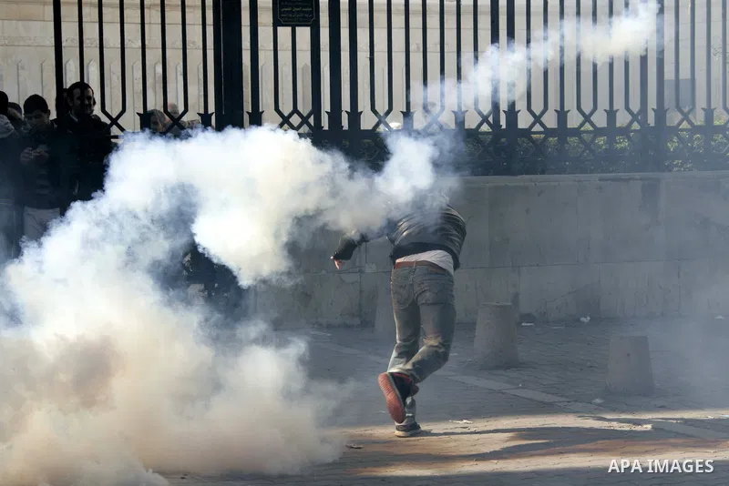 Tunisian policemen fire tear gas canisters at protestors during a demonstration against Prime Minister Mohammed Ghannouchi in front of the government palace in Tunis.Tunisia, 26 January 2011, Hundreds of defiant Tunisian...