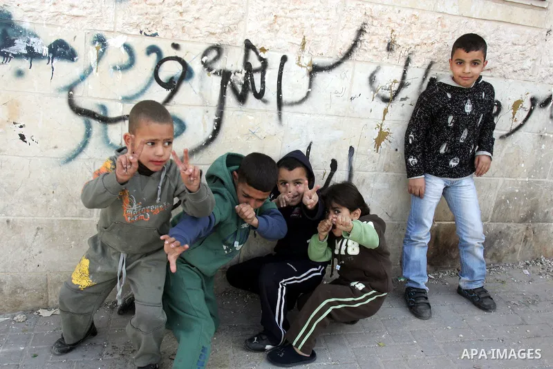 Palestinian children play in the mostly Arab neighbourhood of Silwan in east Jerusalem on Jan 26, 2011. A day after leaked documents were published by Al-Jazeera, showing Palestinians offered Israel major concessions on...