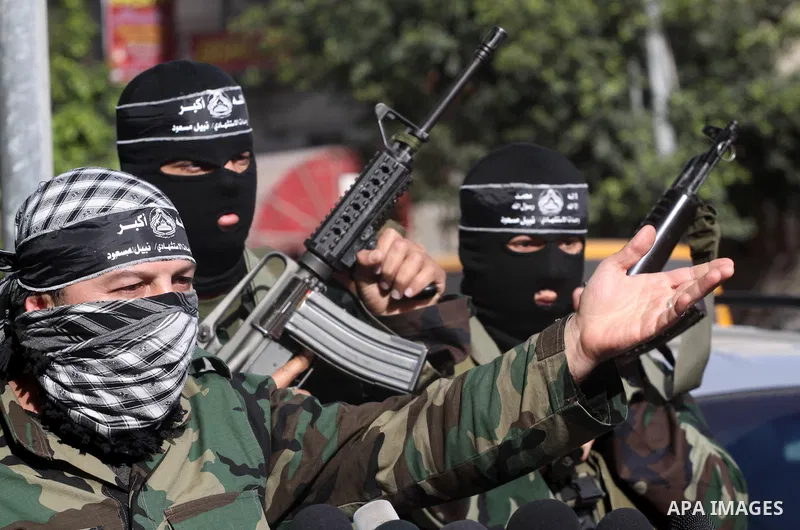 Palestinian militants from the al-Aqsa Martyrs Brigades give a press conference in which they denounced the alleged major concessions made by rival Palestinian leaders during peace talks with Israel, on January 27, 2011...