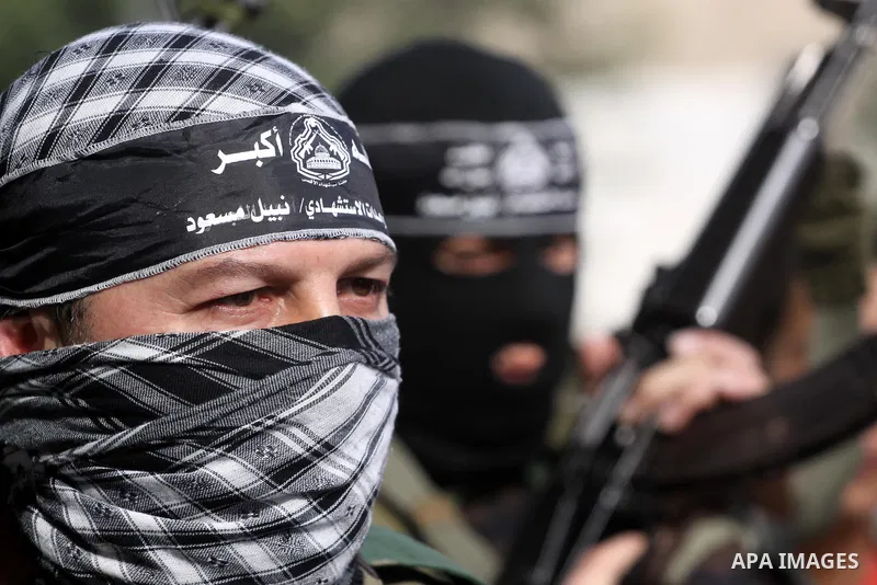 Palestinian militants from the al-Aqsa Martyrs Brigades give a press conference in which they denounced the alleged major concessions made by rival Palestinian leaders during peace talks with Israel, on January 27, 2011...