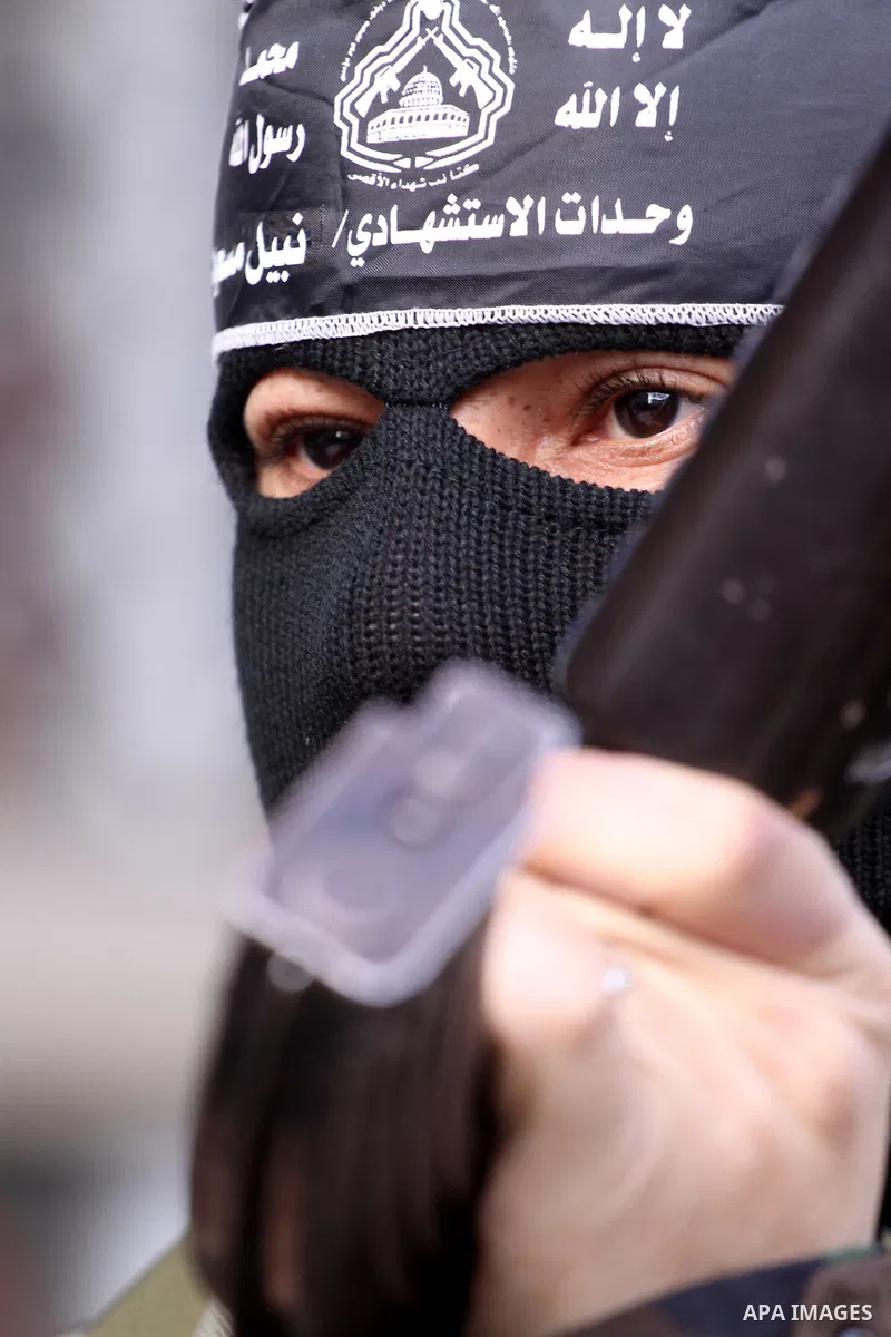 A Palestinian militant from the al-Aqsa Martyrs Brigades attends a press conference in which they denounced the alleged major concessions made by rival Palestinian leaders during peace talks with Israel, on January 27, 2...