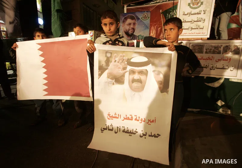 Palestinian Hamas activists take part rally against Abbas, following a recent broadcast by Al-Jazeera reportedly linking him to making broad concessions to Israel in peace talks, in Rafah, southern Gaza Strip, Wednesday,...