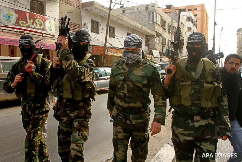 Masked Palestinian militants of a group affiliated with the Al Aqsa Martyrs Brigades attend a press conference in Gaza City, Thursday, Jan. 27, 2011. Members of the tiny offshoot of the now largely defunct militant group...
