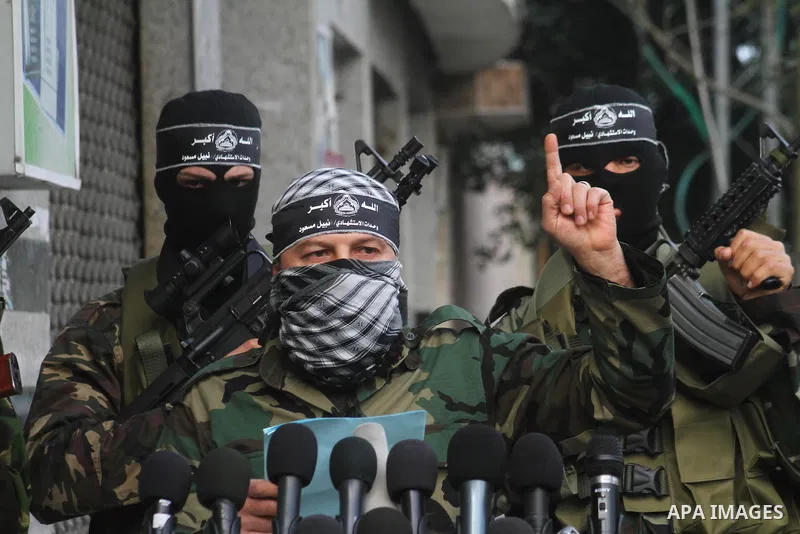 Palestinian militants from the al-Aqsa Martyrs Brigades give a press conference in which they denounced the alleged major concessions made by rival Palestinian leaders during peace talks with Israel, on January 27, 2011...